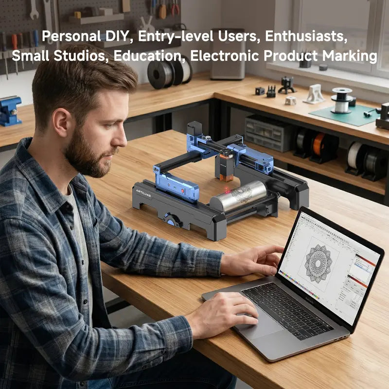 ARTILUME T1 workshop engraving scene with laptop and cylindrical object