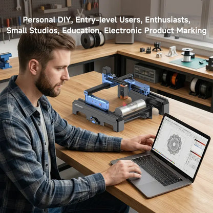 ARTILUME T1 workshop engraving scene with laptop and cylindrical object